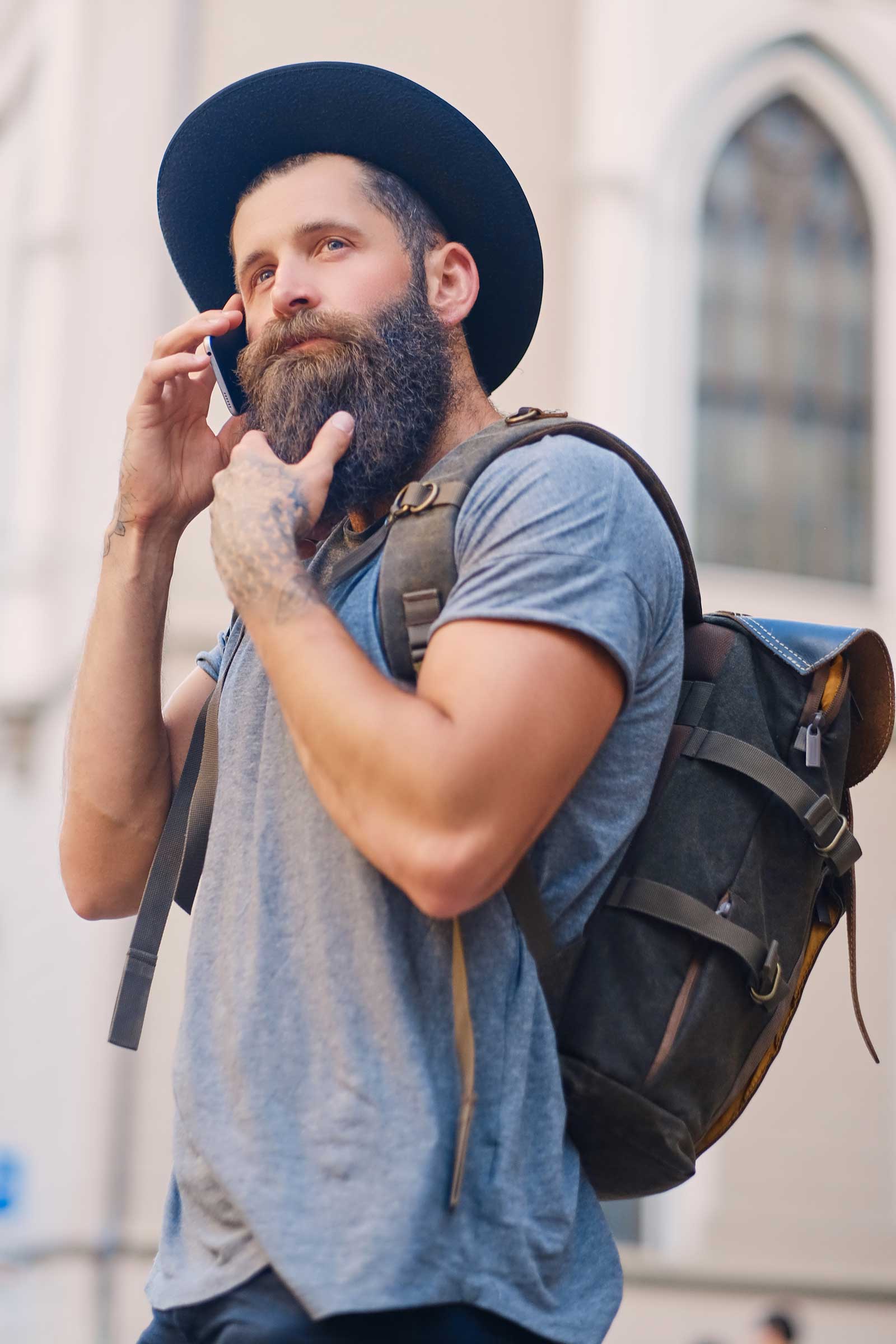 bearded-traveller-male-using-a-smartphone-in-a-tow-2021-08-29-03-25-28-utc.jpg