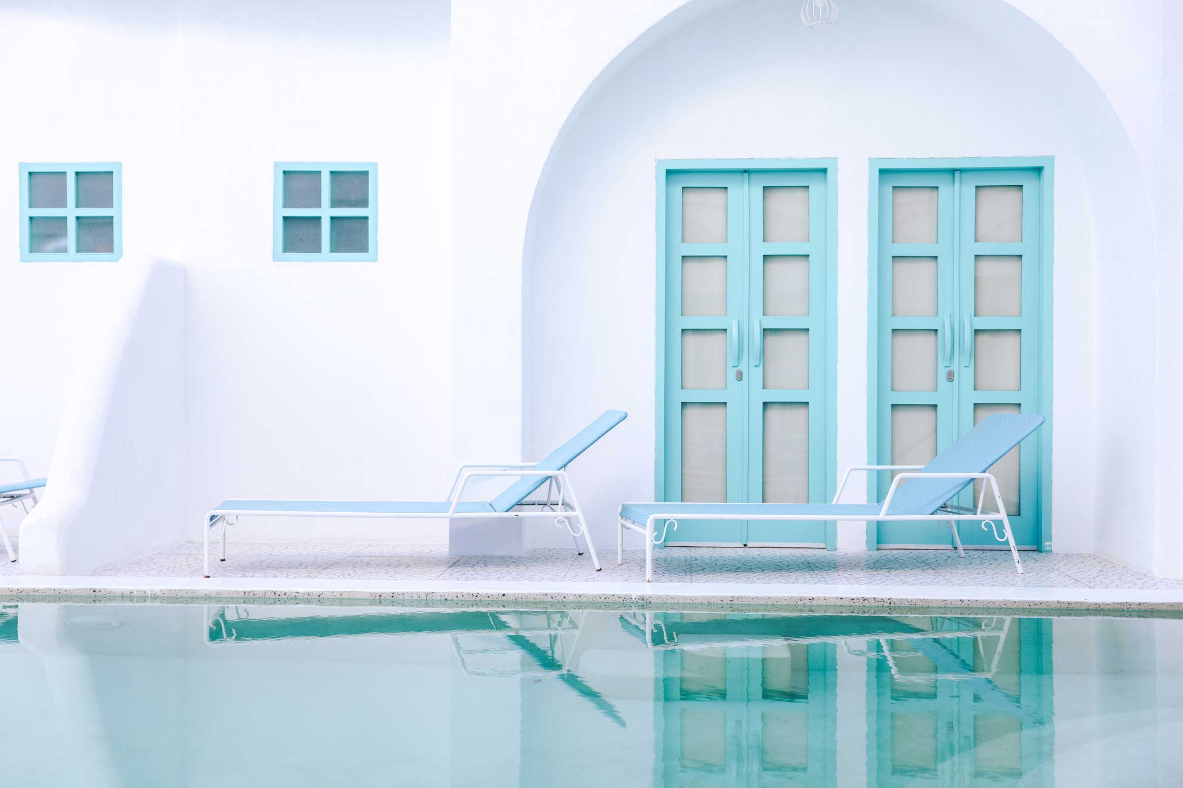 row-of-blue-relaxing-chair-by-the-pool-2021-09-04-16-26-19-utc.jpg